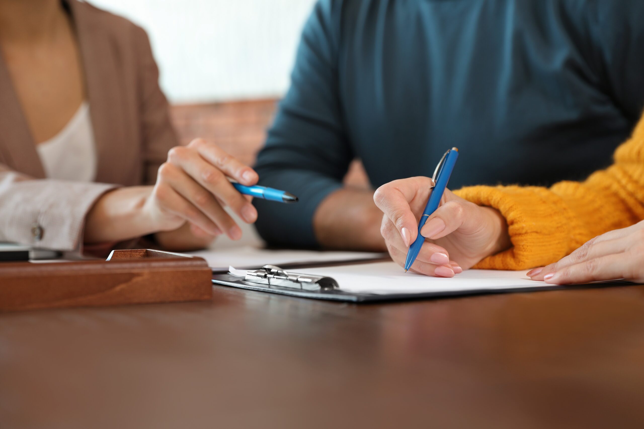 lawyer sitting with a client at a table