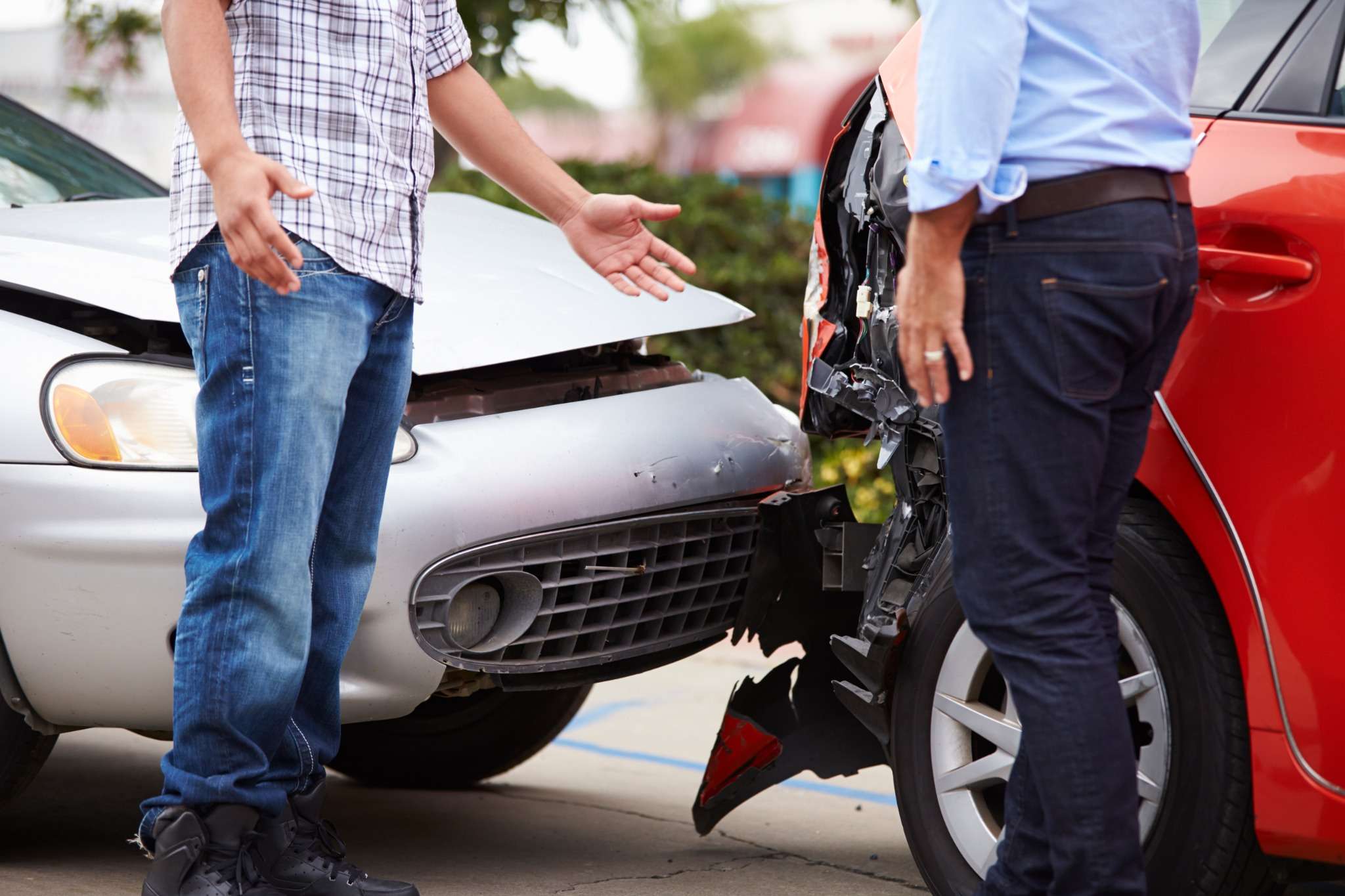 two people talking after a car crash